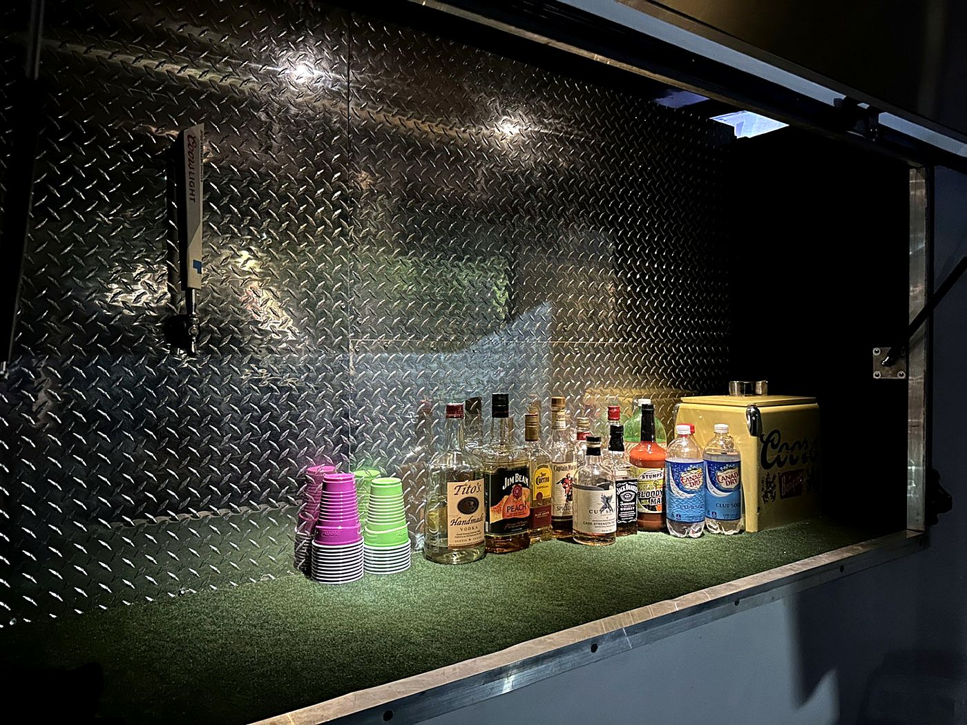 The Celebration Suite serving window lit up with drinks set out