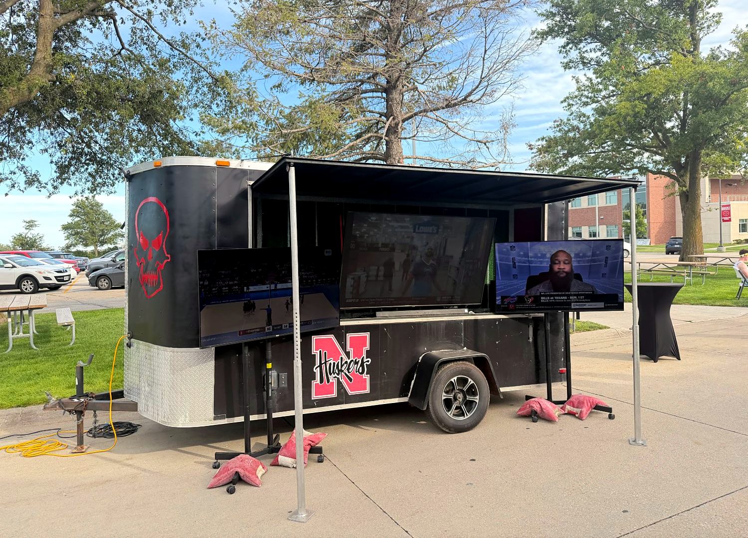 The Sports Book trailer with three TVs showing games